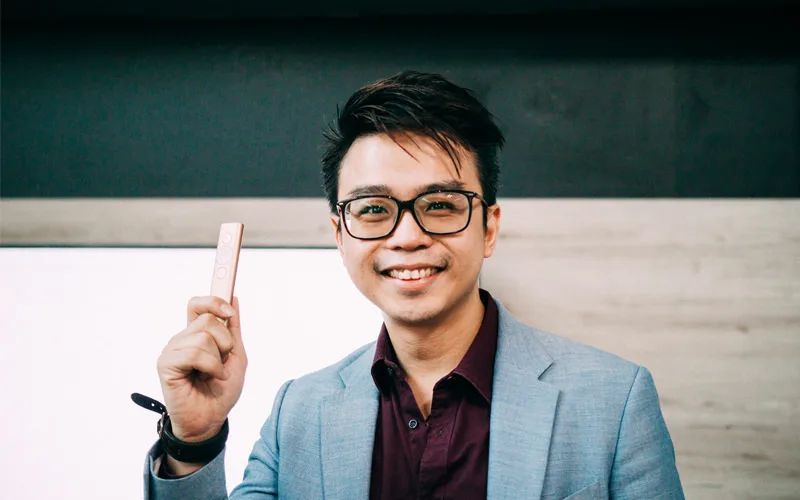 Sales trainer David King holding the Logitech Spotlight